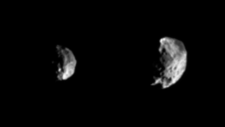 Phoebe grows larger and larger in these two views, captured by the Cassini spacecraft on Thursday. A large crater is visible in the image at left, taken from 594,000 miles away. The image at right, taken from a distance of 409,000 miles, shows a body heavily pitted with craters of varying sizes. Cassini flew within 1,240 miles of the moon on Friday.