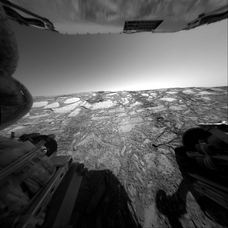 This view from the Mars Exploration Rover Opportunity's rear hazard-avoidance camera looks back up toward the \"Endurance Crater\" rim from the deepest point of a dip into the crater during the rover's 134th martian day, or sol, on June 9, 2004. In this image, the rover is pitched forward about 18 degrees and the rear wheels are about 30 centimeters (about 12 inches) below the rim of the crater. The success of this engineering test of the slope and rock surface led rover planners to make plans to proceed into the crater for further scientific investigation.