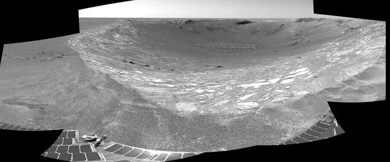 This cylindrical-projection view from the Opportunity rover looks into Endurance Crater in Mars' Meridiani Planum region, with the rover's course straight ahead.