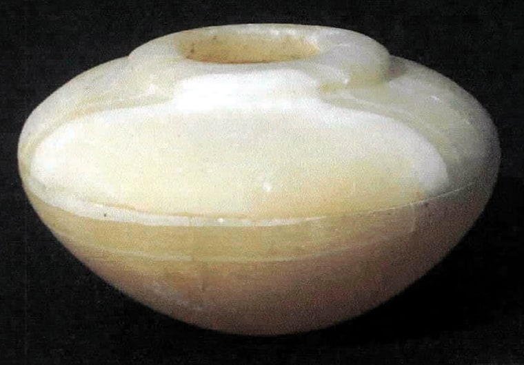 An alabaster pot discovered by Australian archaeologists who unearthed a 5,000-year-old necropolis with 20 well-preserved tombs dated to the first and fourth dynasties in Helwan town south of Cairo is seen in this photo released Sunday June 13, 2004. (AP Photo/HO)