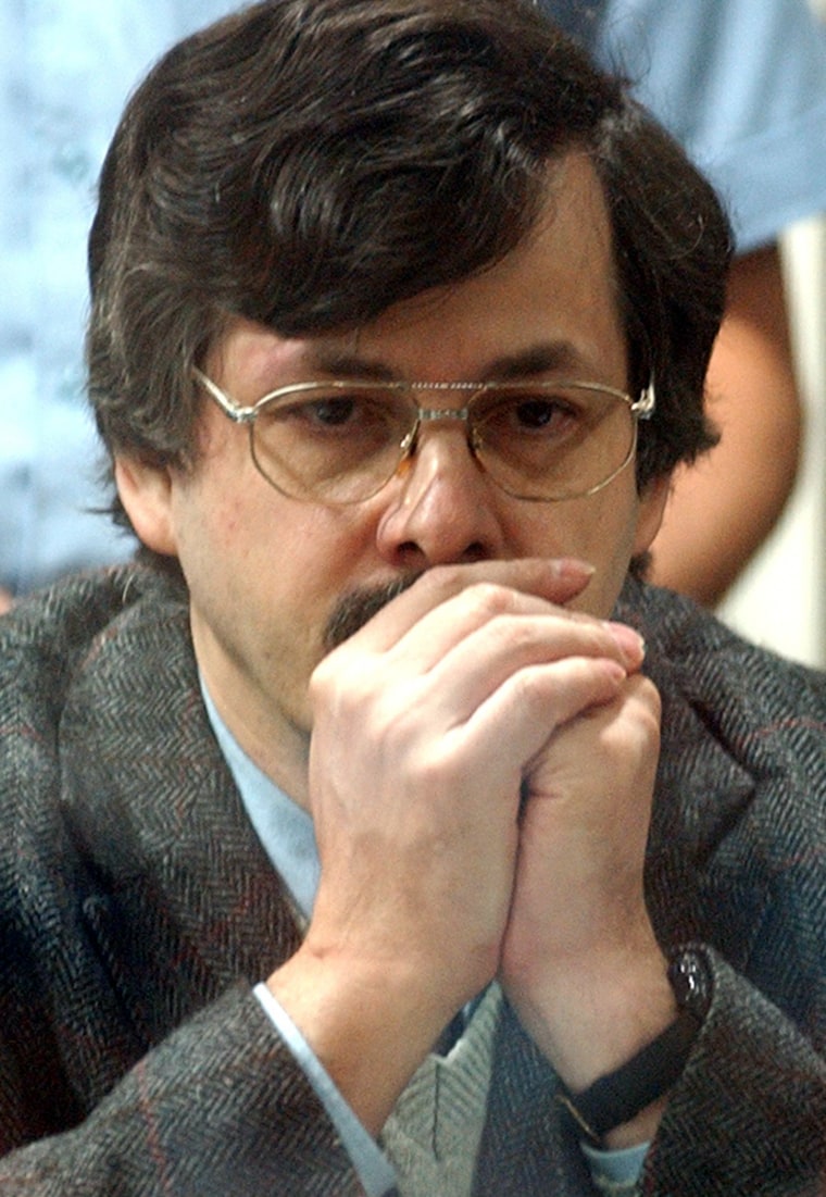DUTROUX SITS IN THE DOCK IN A COURTHOUSE IN ARLON