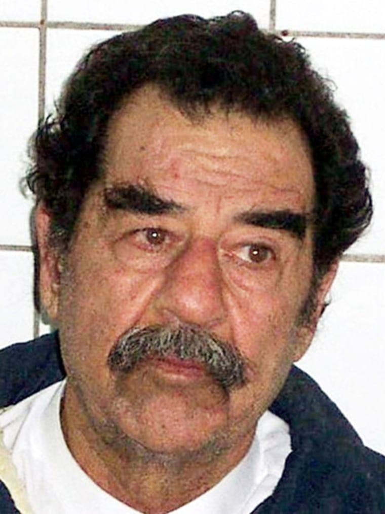 COMBO PHOTO OF CAPTURED SADDAM HUSSEIN SHOWN AT PRESS CONFERENCE IN BAGHDAD