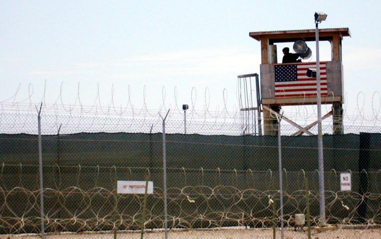 A sentry surveys the main prison compound at Guantanamo.