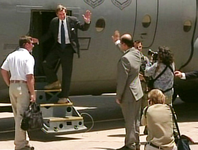Outgoing U.S. administrator in Iraq L. Paul Bremer boards an aircraft to depart Iraq after transferring power to the Iraqis on Monday.