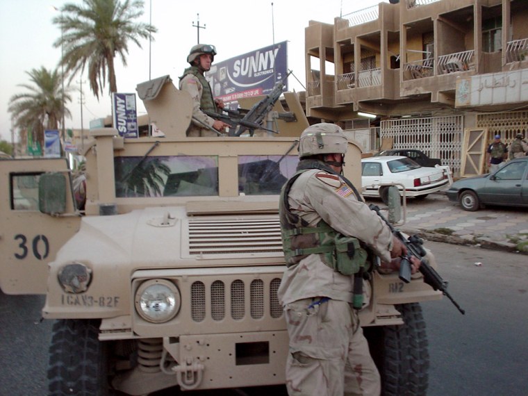 Members of the U.S. Army's First Cavalry Division take part in a raid in Baghdad earlier in June.