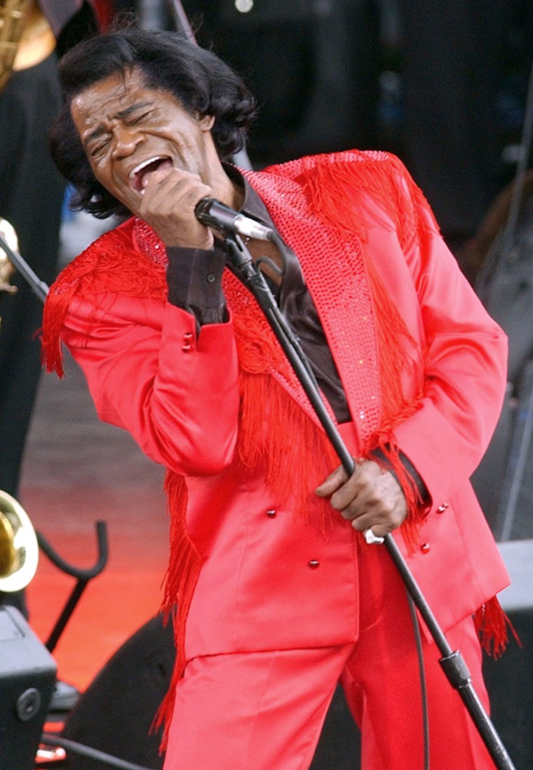 U.S. singer James Brown as he performs at the Olympic Flame concert held on the Mall in London, Saturday June 26, 2004. Brown headed a long line up of stars performing at the concert held to celebrate the Olympic Flame as it passes through London on its way to Athens 2004. (AP Photo/Richard Lewis)