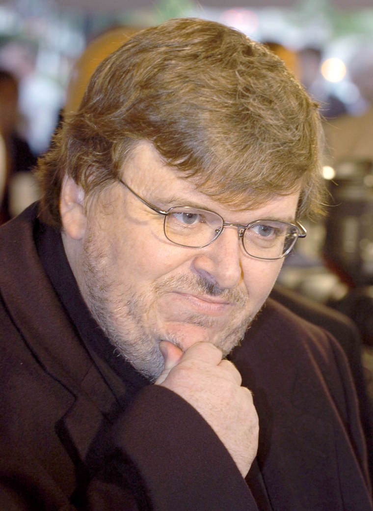 MICHAEL MOORE IS INTERVIEWED DURING THE OPENING OF HIS FILM IN WASHINGTON