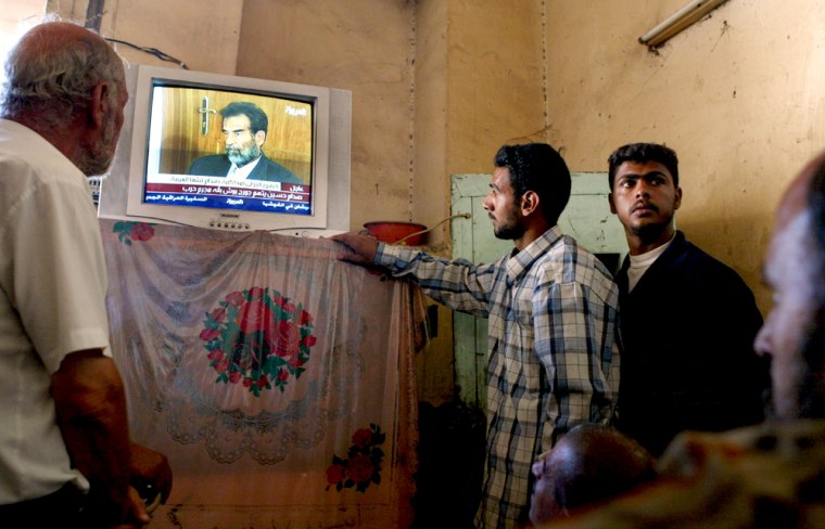 Iraqi's Watch Saddam Hussein Appear In Iraqi Court