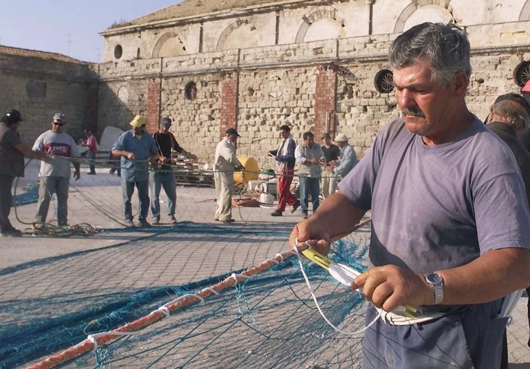 Fishermen on Favignana Island in southern Italy prepare their nets for tuna catches, even though little has been caught in recent years.