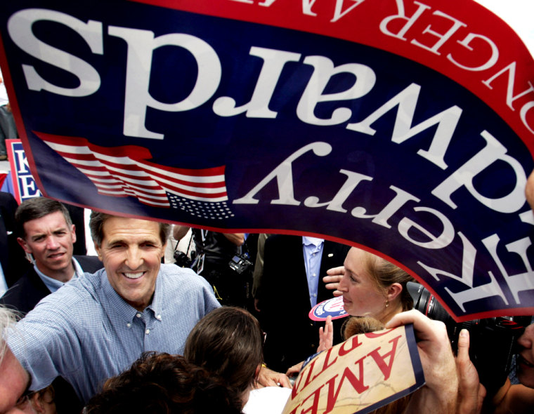 Democratic presidential candidate Kerry reaches out into the crowd at a rally