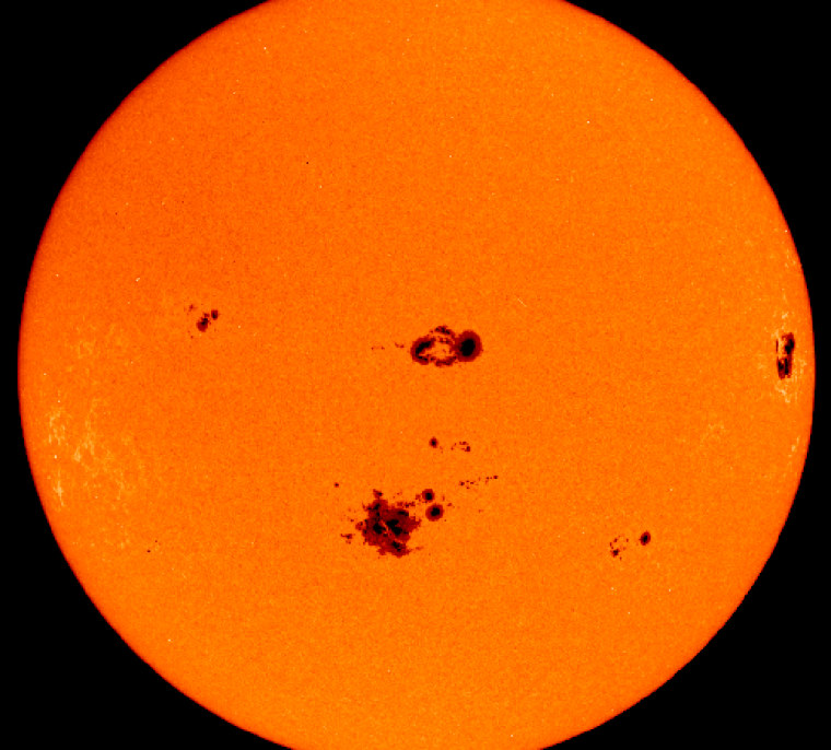 Sunspots serve as an indicator of overall solar activity. During last October's wave of solar storms, the sun's disk was speckled with sunspots, as shown in this image from the Solar and Heliospheric Observatory.
