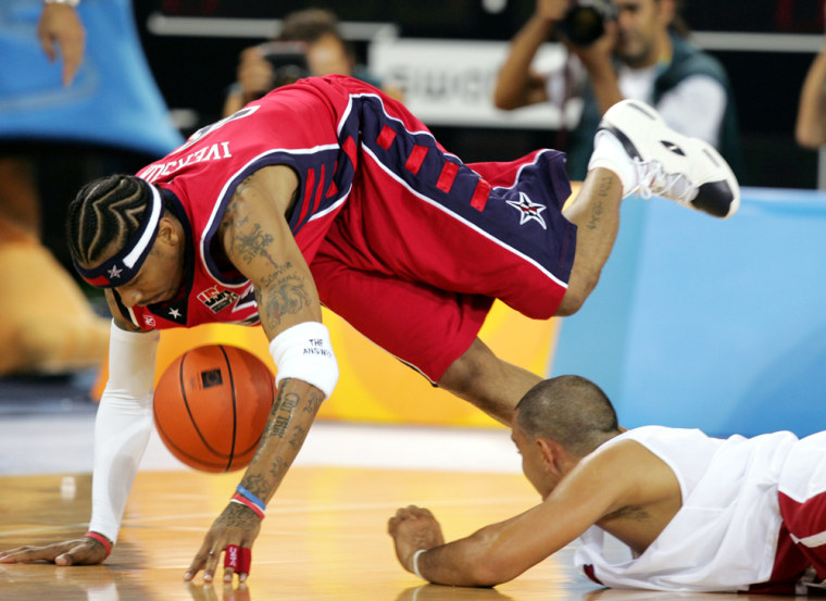 Carlos Arroyo, right, of Puerto Rico, tripped up Allan Iverson and his U.S. teammates Sunday when Puerto Rico won 92-73. The Puerto Ricans didn't just win, they were better, writes columnist Michael Wilbon.