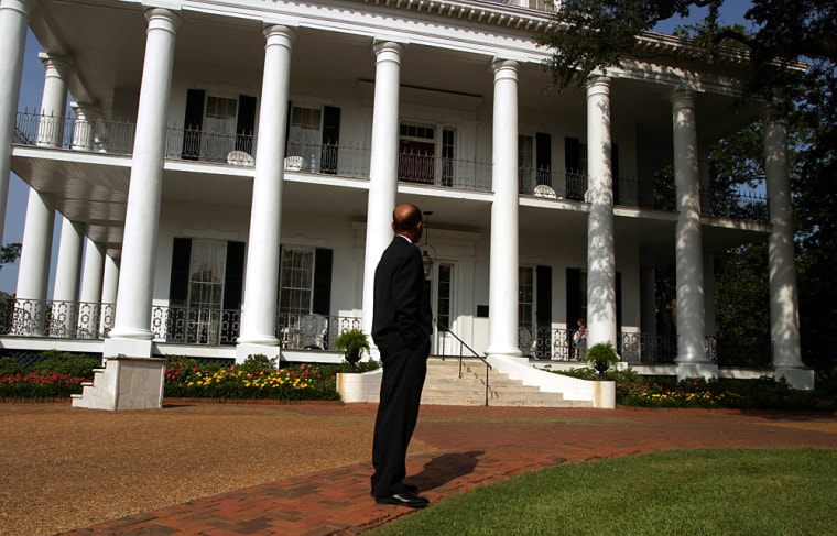 Mayor West looks at the Dunleith, one of Natchez's beautifully restored plantation homes. He has made it a priority to ask the owners of the city’s antebellum mansions -- Natchez’s top tourist attraction -- to present a balanced picture of plantation life. Black leaders have long found fault with many of the historic showcases, charging that they present an idealized version of the Old South that minimizes the horrors of slavery.