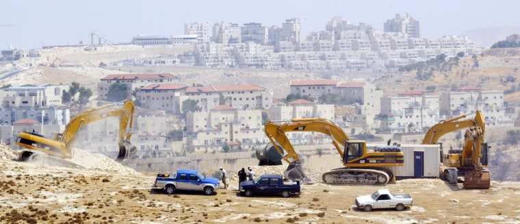 Israeli bulldozers prepare the ground for the construction of a West Bank road, on Aug. 5, on a hill in the outskirts of the Jewish settlement of Maaleh Adumim, where Israeli officials say they will build new housing units. 
