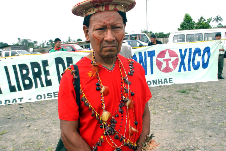 Andres Payaguaje, delegated by Secoya indians, participates in the first day of inspections in the trial against Texaco in the Ecuadorean Amazonian region in Joya de los Sachas, Ecuador, Wednesday, Aug. 18, 2004. Texaco has been facing charges of ecological damages during operations in this region. (AP Photo/Dolores Ochoa)