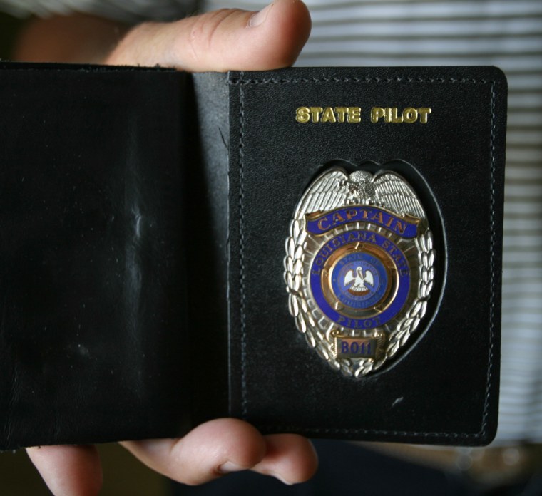 IMAGE: BAR PILOT HOLDS BADGE