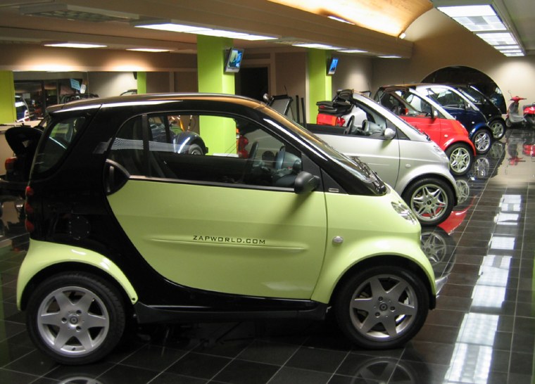 Several smart cars sit in a showroom for potential dealers at the headquarters for ZAP. The company, based in Santa Rosa, Calif., had specialized in electric vehicles but is branching out to sell thousands of the high mileage, gasoline-powered cars.