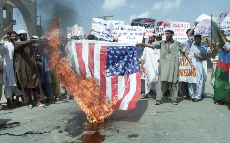 Islamic religious students burn U.S. flag in Multan