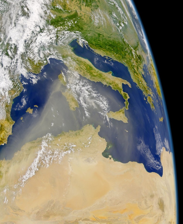 This satellite image taken Thursday shows a large plume of Saharan Desert dust blowing northeastward over the Mediterranean Sea and Greece. The dust can be seen extending in a wide arc off Africa's northern coastline.