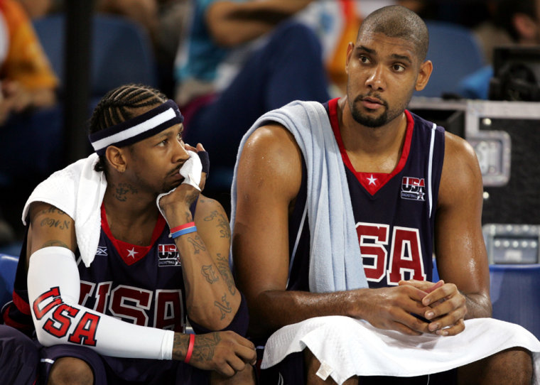 Tim Duncan, right, sitting with guard Allen Iverson, declared his international basketball career "95 percent" over after the U.S. team's bronze medal.