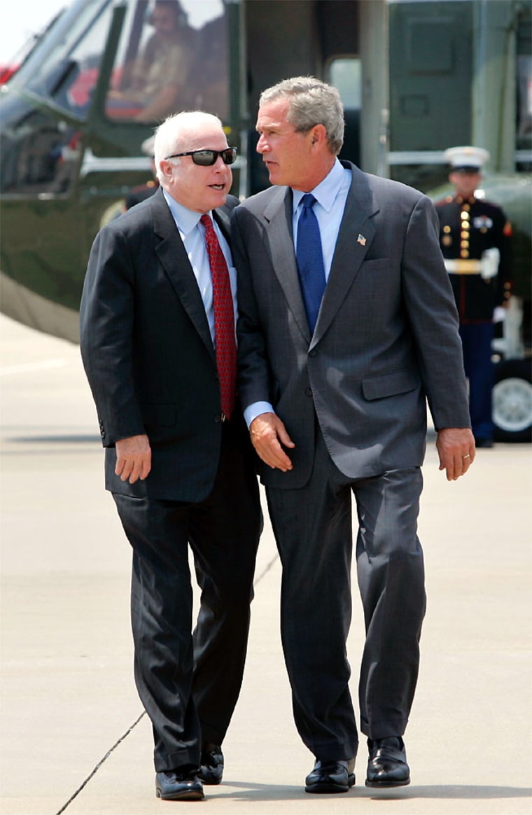 Bush and McCain walk together toward Air Force one