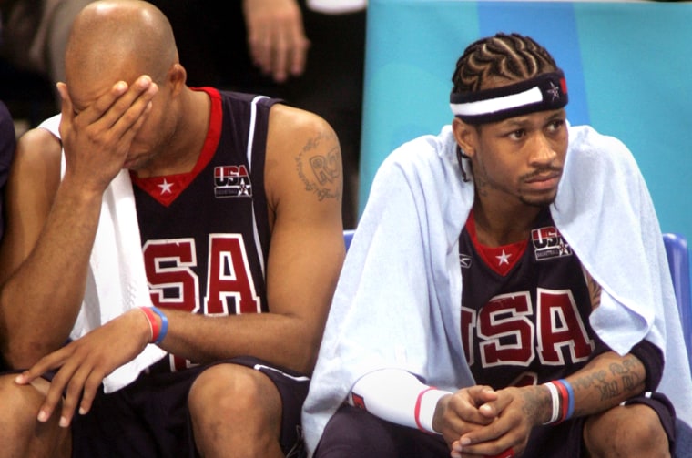 Jefferson and Iverson of the U.S. sit on bench during men's Olympic basketball semi-final against Argentina