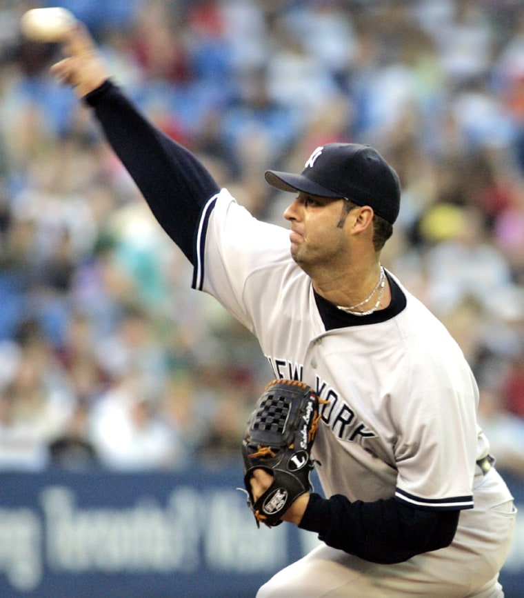 Yankees starting pitcher Esteban Loaiza delivers a pitch against the Blue Jays