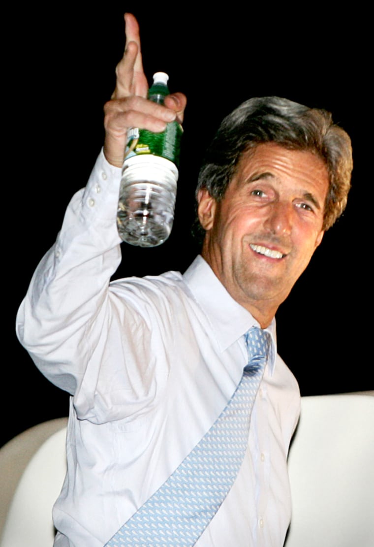 U.S. Democratic presidential nominee Kerry waves from plane