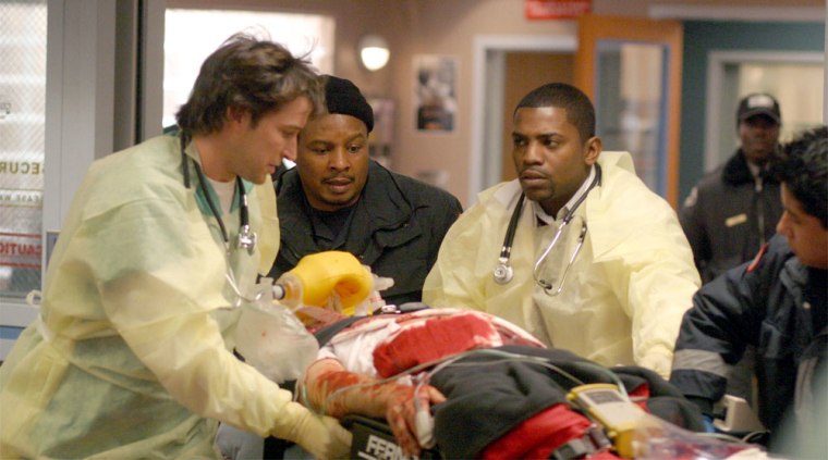 ER -- NBC Series -- \"Blood Relations\" -- Pictured: (left, second from right) Noah Wyle as Dr. John Carter, Mekhi Phifer as Dr. Gregory Pratt -- Warner Bros. photo