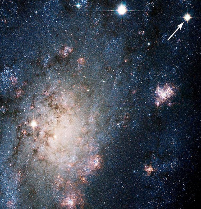 In this image from the Hubble Space Telescope's Advanced Camera for Surveys, an arrow indicates the supernova known as SN 2004dj. It was first detected by a Japanese amateur astronomer on July 31, and rates as the closest stellar explosion discovered in more than a decade.