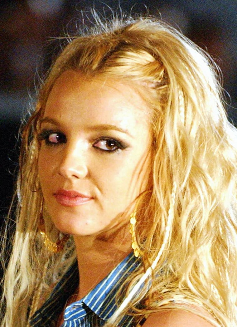 ** FILE ** Britney Spears appears on set filming her new video when she injured her knee, in this June 8, 2004 file photo in Queens, New York. (AP Photo/Jennifer Graylock, File)