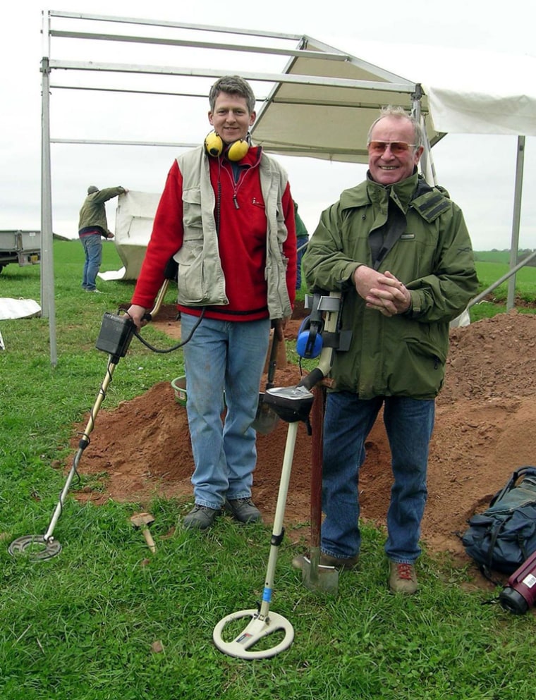 Peter Adams, right, who discovered a Viking brooch using a metal detector, described the site as "the find of a lifetime."  