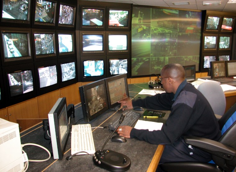 Tony Savage monitors and manipulates images taken by 100 CCTV cameras placed above storefronts across central London, in the Westminster control room beneath the Trocadero at Piccadilly Circus.