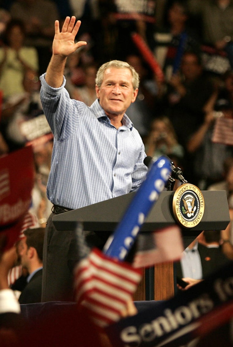 U.S. President George W. Bush waves to supporters during an election rally in Johnstown, Pennsylvania