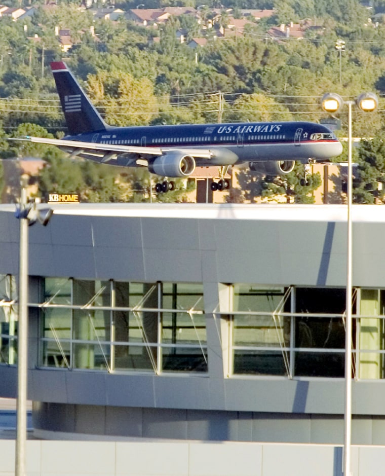 A US Airways jet lands at McCarran International Airport in Las Vegas