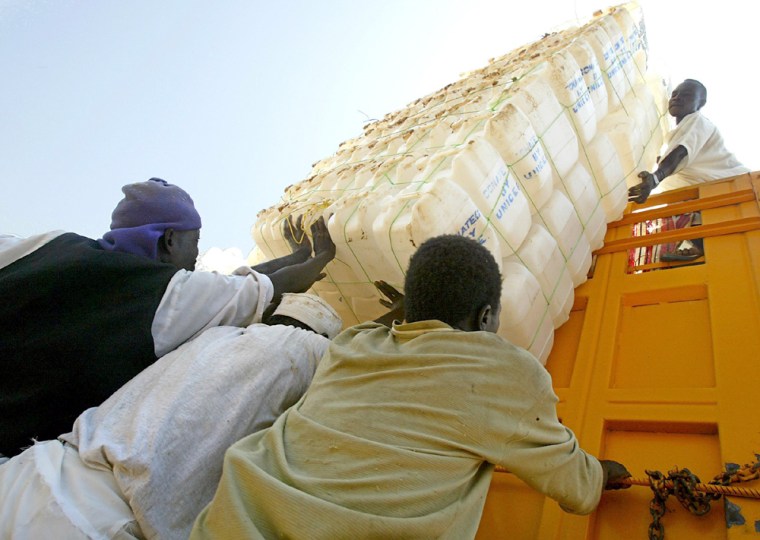 Sudanese relief workers load a truck wit