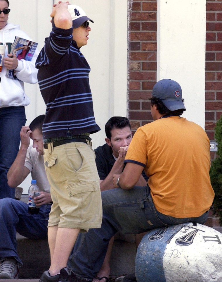 Students gather outside the Sigma Pi fraternity house in Fort Collins, Colo., Monday, Sept. 6, 2004. Police suspect drinking contributed to the death of a Colorado State University student whose body was discovered over the weekend in the Sigma Pi fraternity house.  It's not clear what Samantha Spady, 19, a sophomore business major from Beatrice, Neb., was doing in the Sigma Pi fraternity. Her body was discovered Sunday evening in a lounge by a fraternity member giving a tour of the house to his mother. (AP Photo/Dennis Schroeder, Pool)