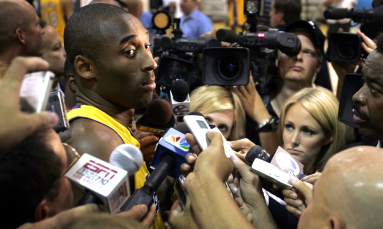 Los Angeles Lakers guard Kobe Bryant is surrounded by media during team media day in El Segundo
