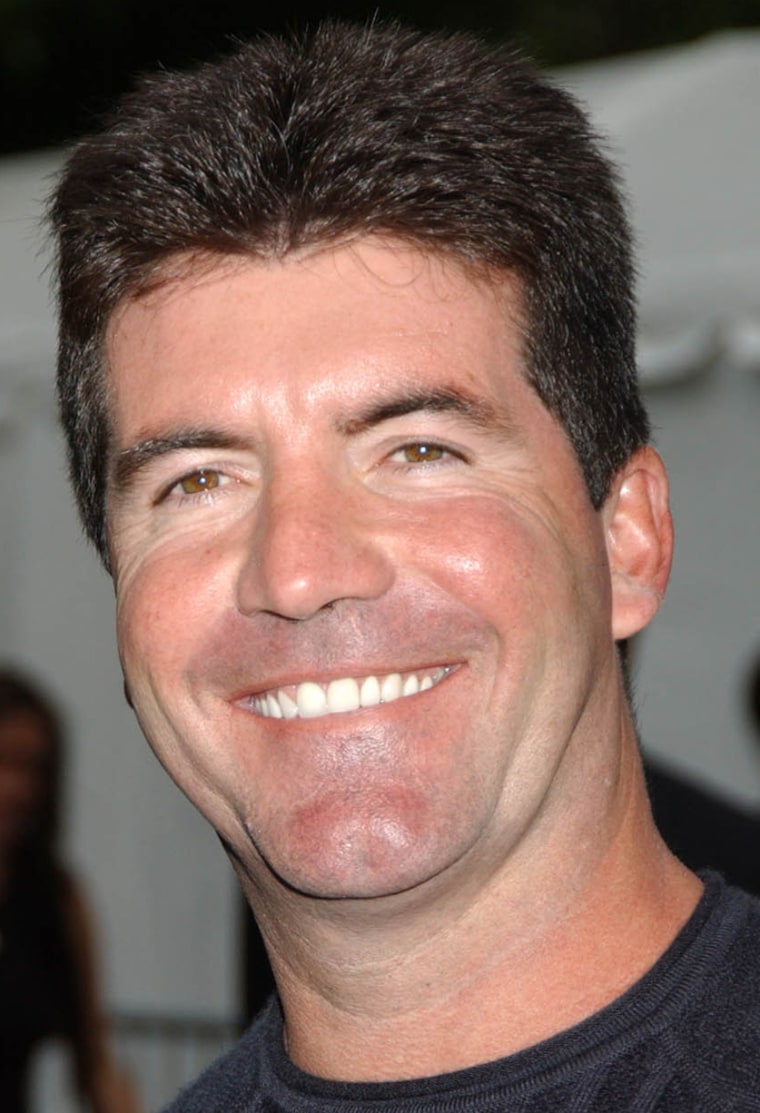 Simon Cowell attends
the Fox Television primetime preview 2004-2005, held at the Central Park Boat House, Thursday, May 20, 2004 in New York.
(AP Photo/Jennifer Graylock)