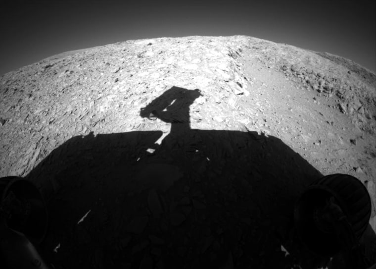 The Spirit rover's silhouette stands out on the terrain of Mars' Columbia Hills in this picture, taken by the rover's front hazard-avoidance camera.