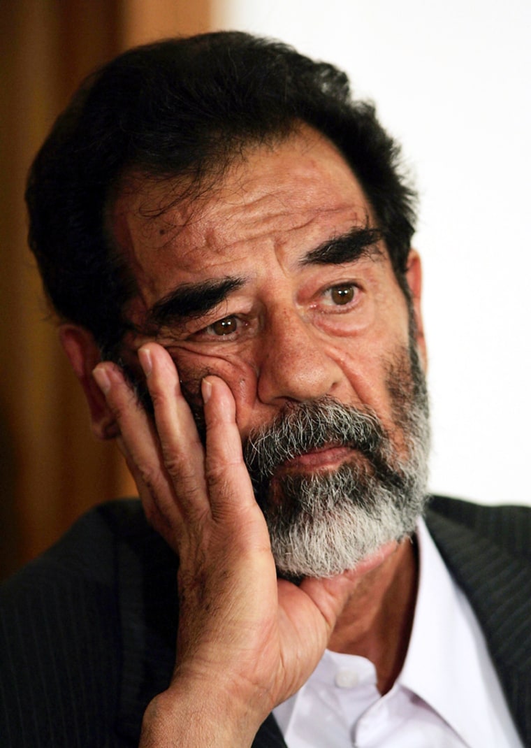 Saddam Hussein Hears Charges Read In Iraqi Court