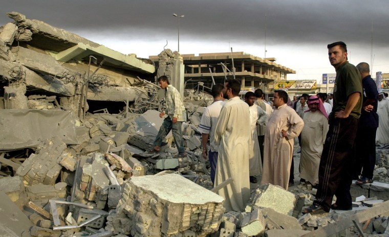 Fallujah residents search through the rubble of a building Tuesday after a U.S. air strike.