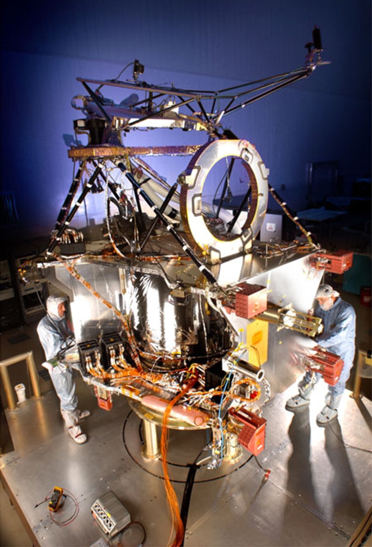 Teams of engineers and technicians at Lockheed Martin Space Systems are busy at work assembling and testing NASA's Mars Reconnaissance Orbiter. Shown here is MRO’s “bus” — the central core of the spacecraft — in a cleanroom at the company's Denver facility.