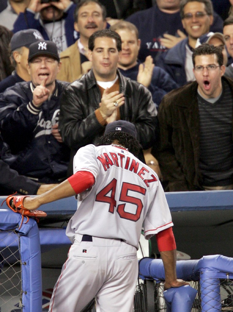 Yankees fans jeer at Red Sox pitcher Pedro Martinez after sixth inning in Game 2 of the ALCS
