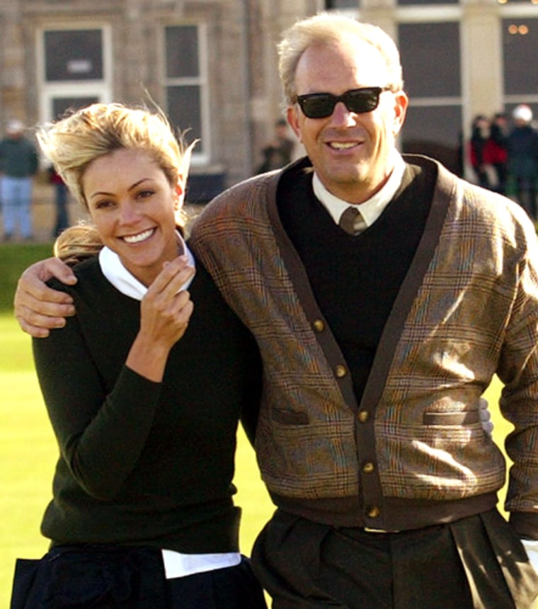 Actor Costner walks with wife Christine during practice round for Dunhill Links Championship in Scotland