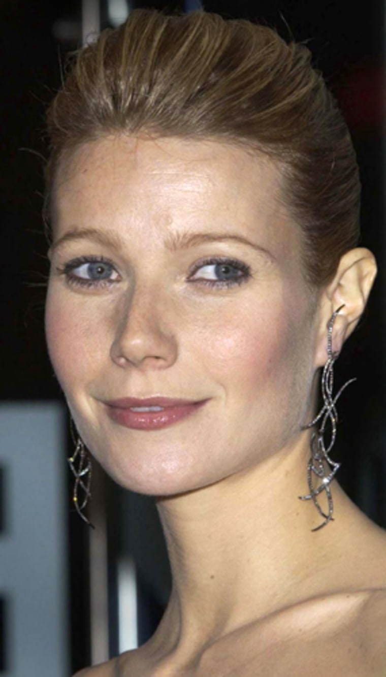 ** FILE ** Hollywood star Gwyneth Paltrow shown in this Nov. 6, 2003 file photo, in London, has given birth to her first child - a baby girl - at a London hospital, Friday May 14, 2004. She and her singer husband Chris Martin, of the band Coldplay, named their daughter Apple Blythe Alison Martin.  Both mother and baby were said to be doing fine.   (AP Photo/Myung Yung Kim/PA, File)   **  UNITED KINGDOM OUT - MAGS OUT - NO SALES  **