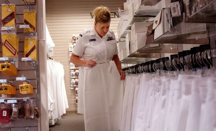 Petty Officer First Class Regina Sharp, stationed at Naval Station Norfolk in Norfolk, Va., looks at skirts at the Navy exchange, on Thursday.