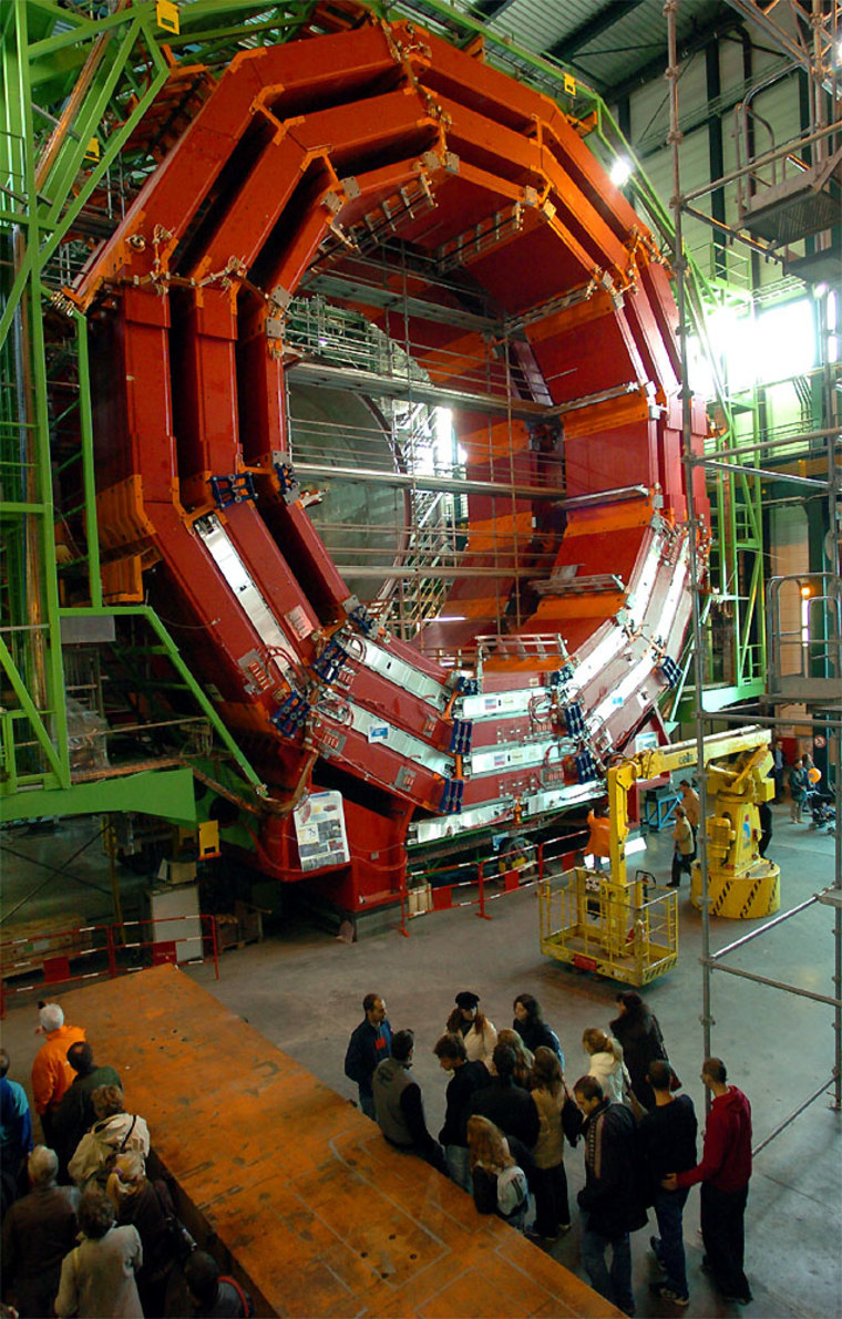 Visitors look at an experimental site during the CERN's 50th anniversary Open day in Geneva