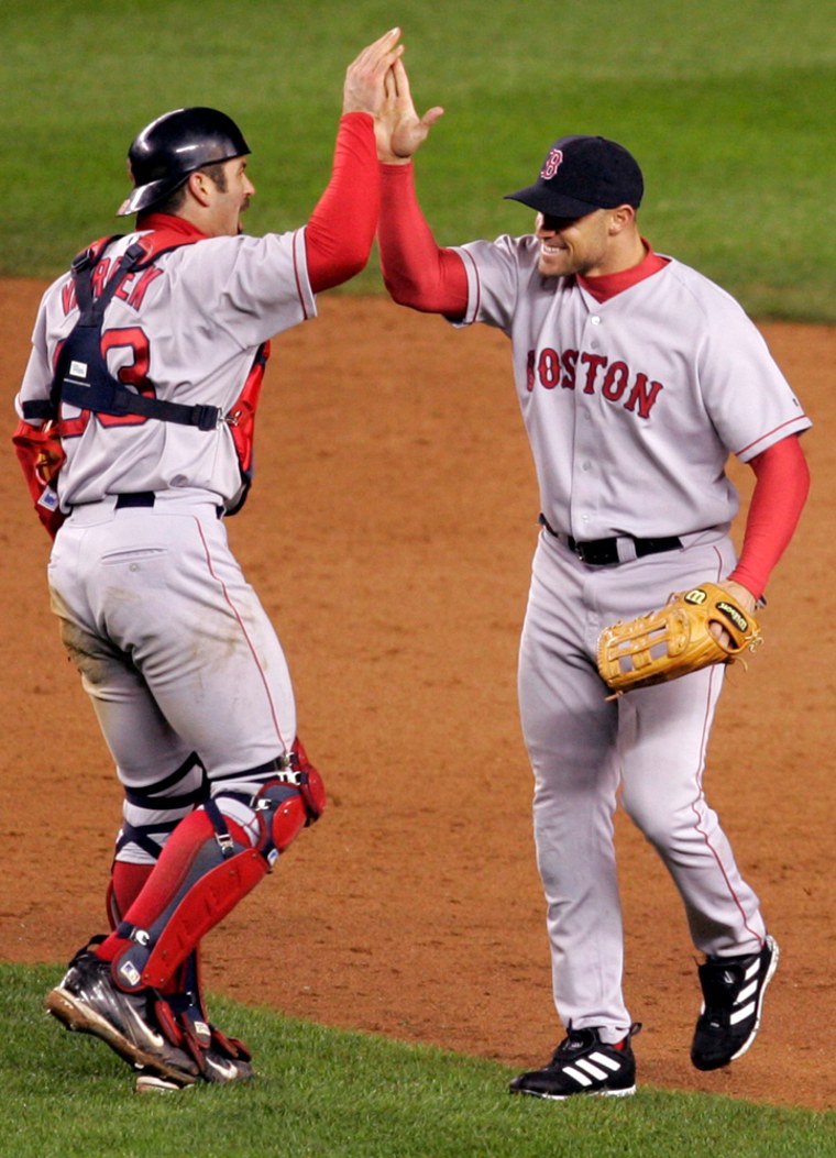 Boston's Jason Varitek, left, and Gabe Kapler celebrate after defeating the New York Yankees on Tuesday.