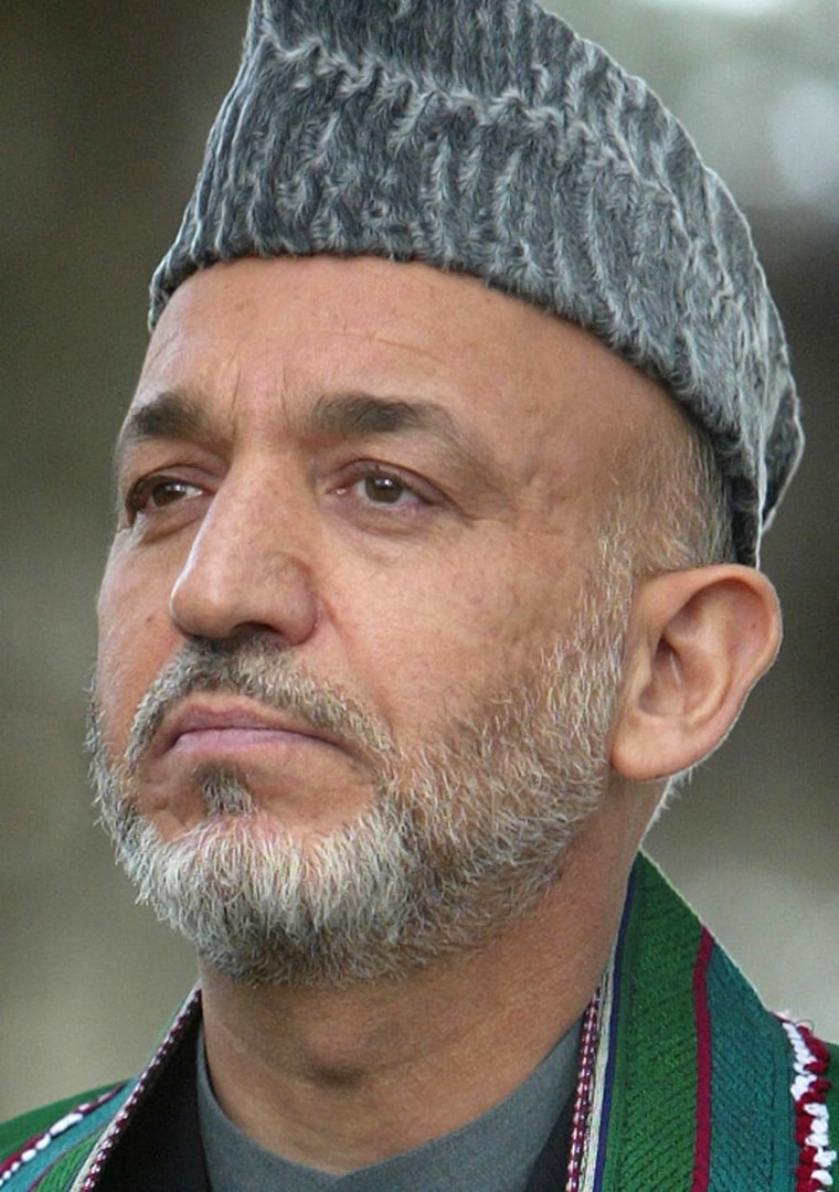 Afghan President Karzai speaks to journalists at the presidential palace in Kabul